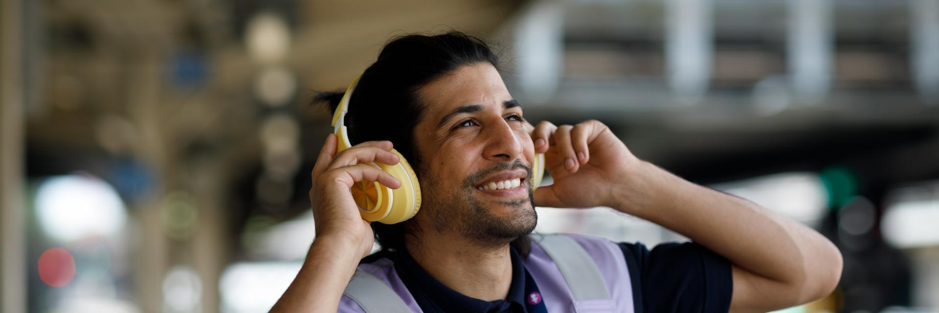 Man smiling wearing ear defenders