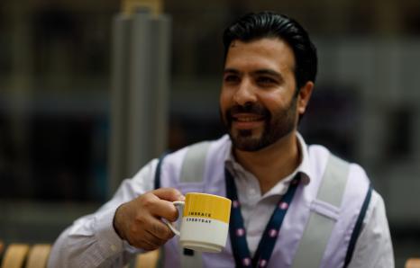 Rail worker drinking a cup of tea