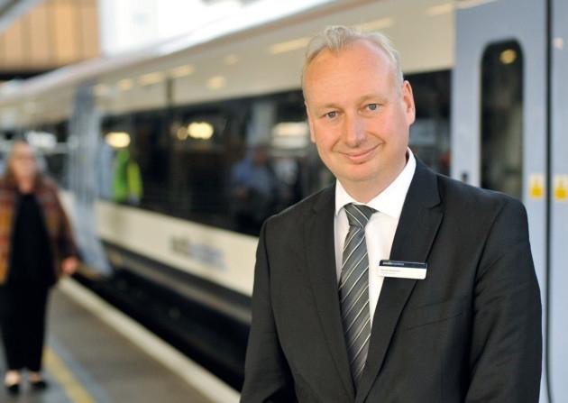 image of a man in front of a train